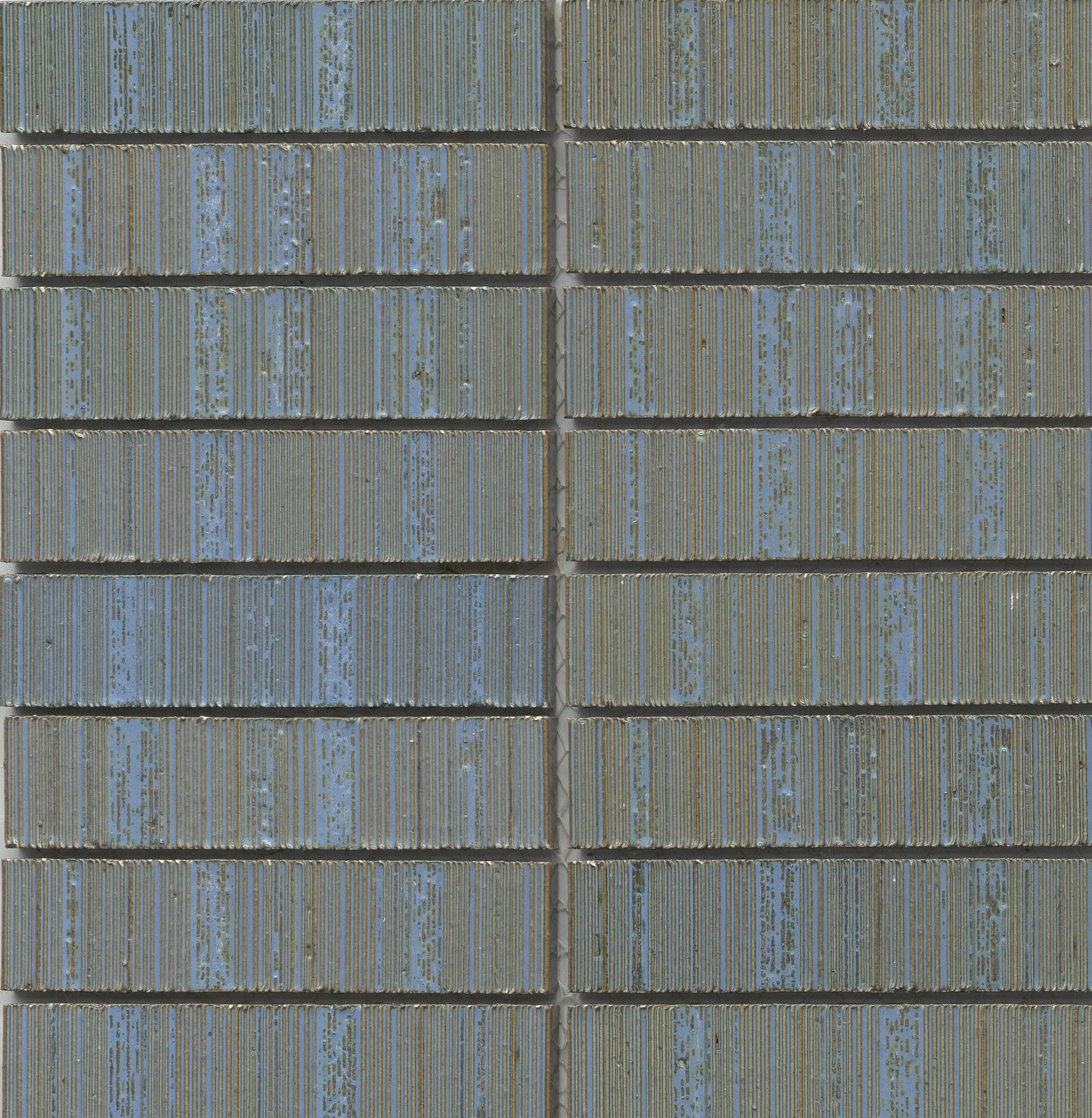 Close-up of Ocean - Newtro - Sample tiles by New York Cement Tile in blue and green geometric grid with visible grout lines.