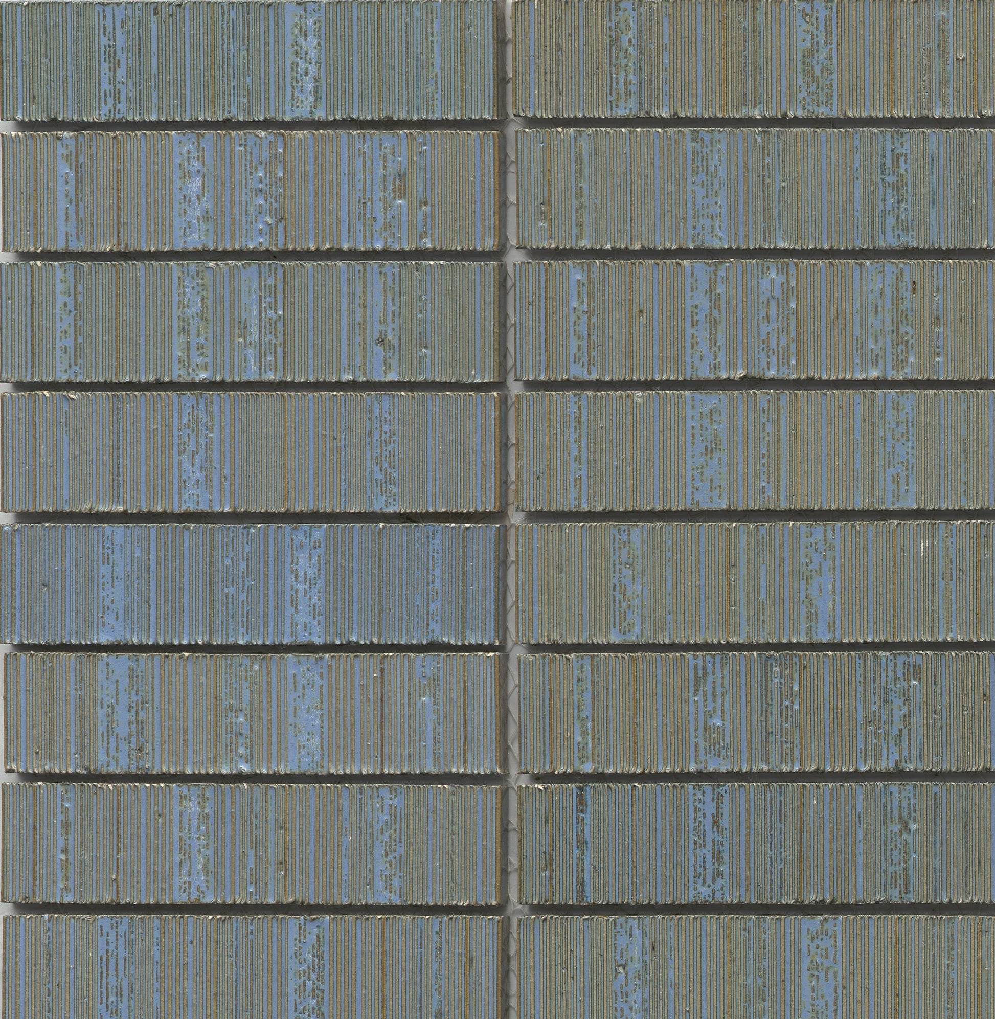 Close-up of Ocean - Newtro - Sample tiles by New York Cement Tile in blue and green geometric grid with visible grout lines.