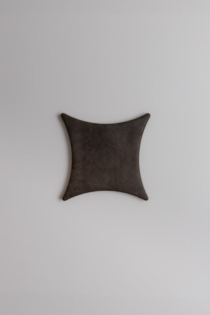The Ocre, Extra Sample by Finca is a black, square leather tray with curved sides on a plain light gray background.