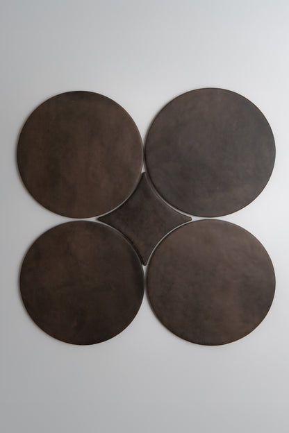 Four large Finca Ocre, Extra Sample disks are arranged in a clover shape on a plain white background.