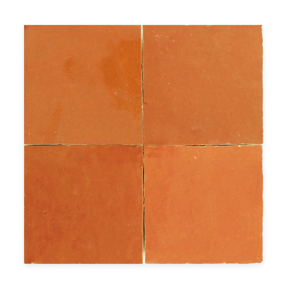 Four square terracotta tiles arranged in a 2x2 grid on a white background.