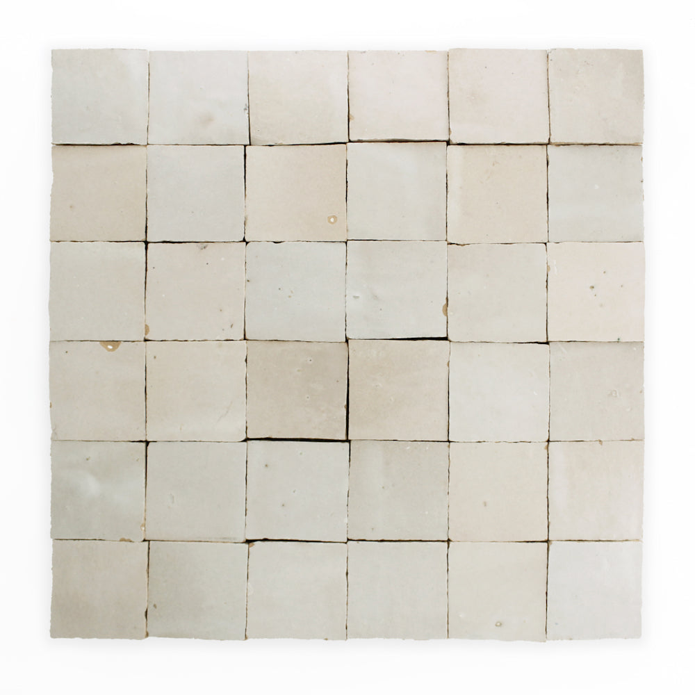 A grid of 36 Pearl Grey 2X2 tiles by New York Cement Tile, handcrafted and off-white, arranged in six rows and columns.