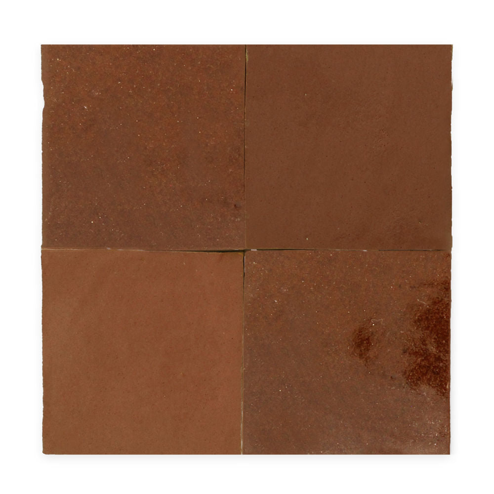 Four square reddish-brown ceramic tiles arranged in a 2x2 grid on a white background.