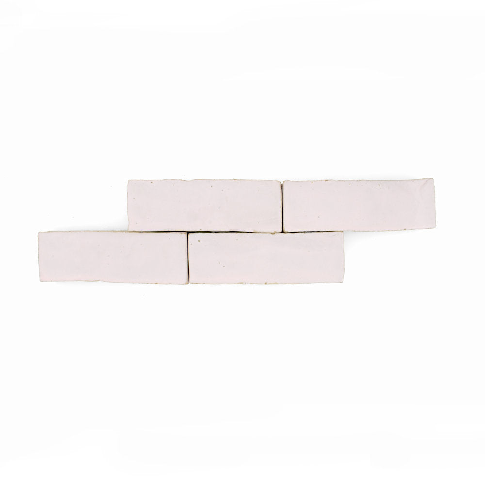 Four Rosy Pink (2x6) tiles by New York Cement Tile in a staggered pattern on a white background.