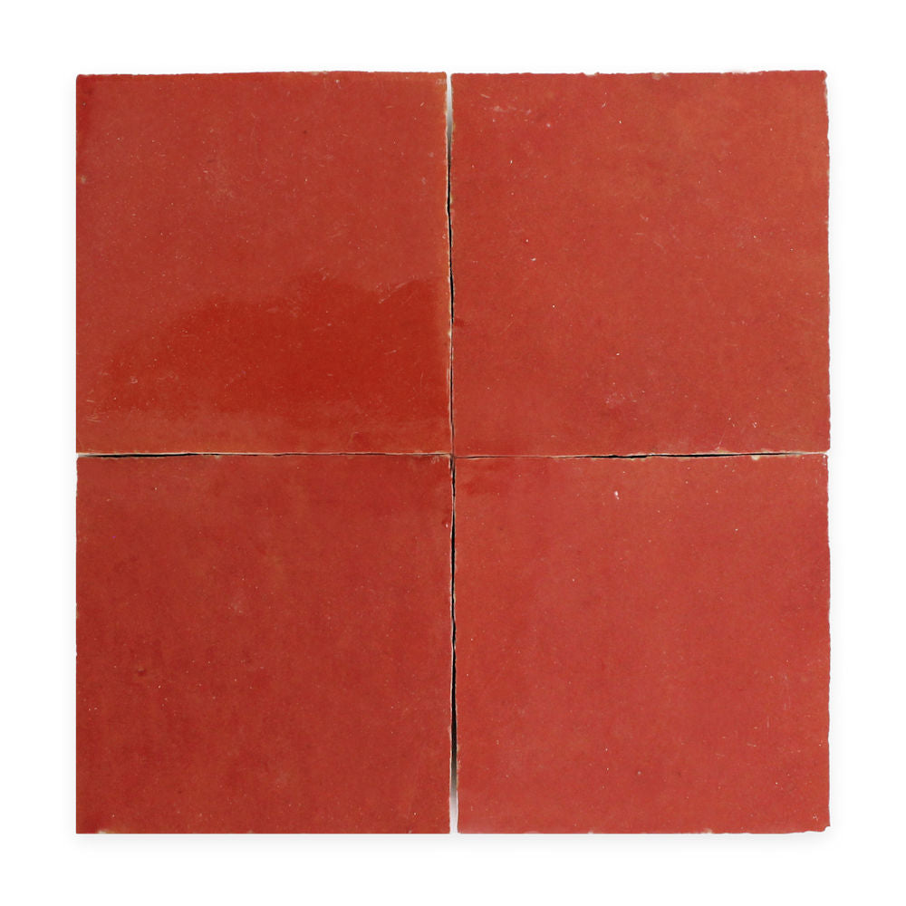 Four square red tiles arranged in a 2x2 grid on a white background.