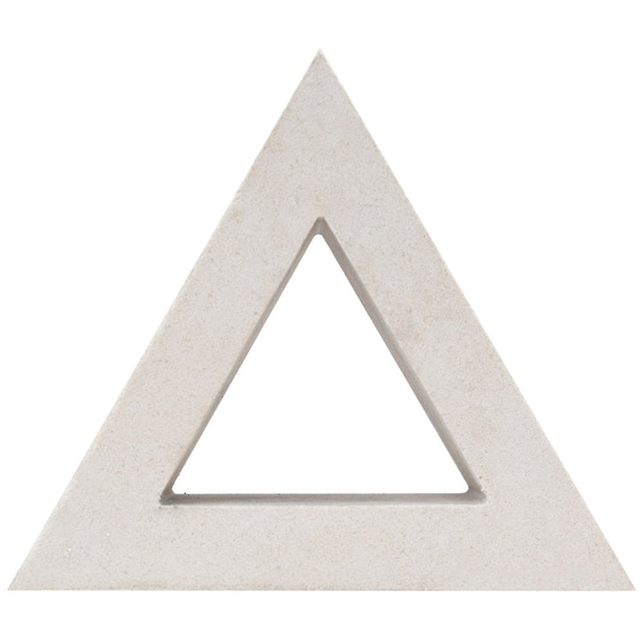 The Nui Triangular by New York Cement Tile is a beige, hollow triangle evoking mid-century design, shown on a white background.