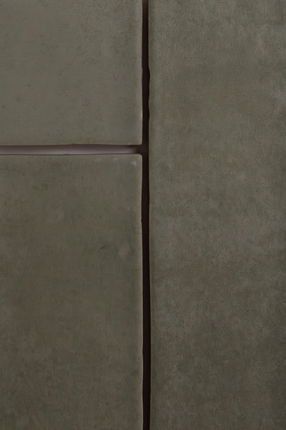 Close-up of four matte Skye Green tiles by Cottage Ivy with visible grout lines arranged in a grid pattern.