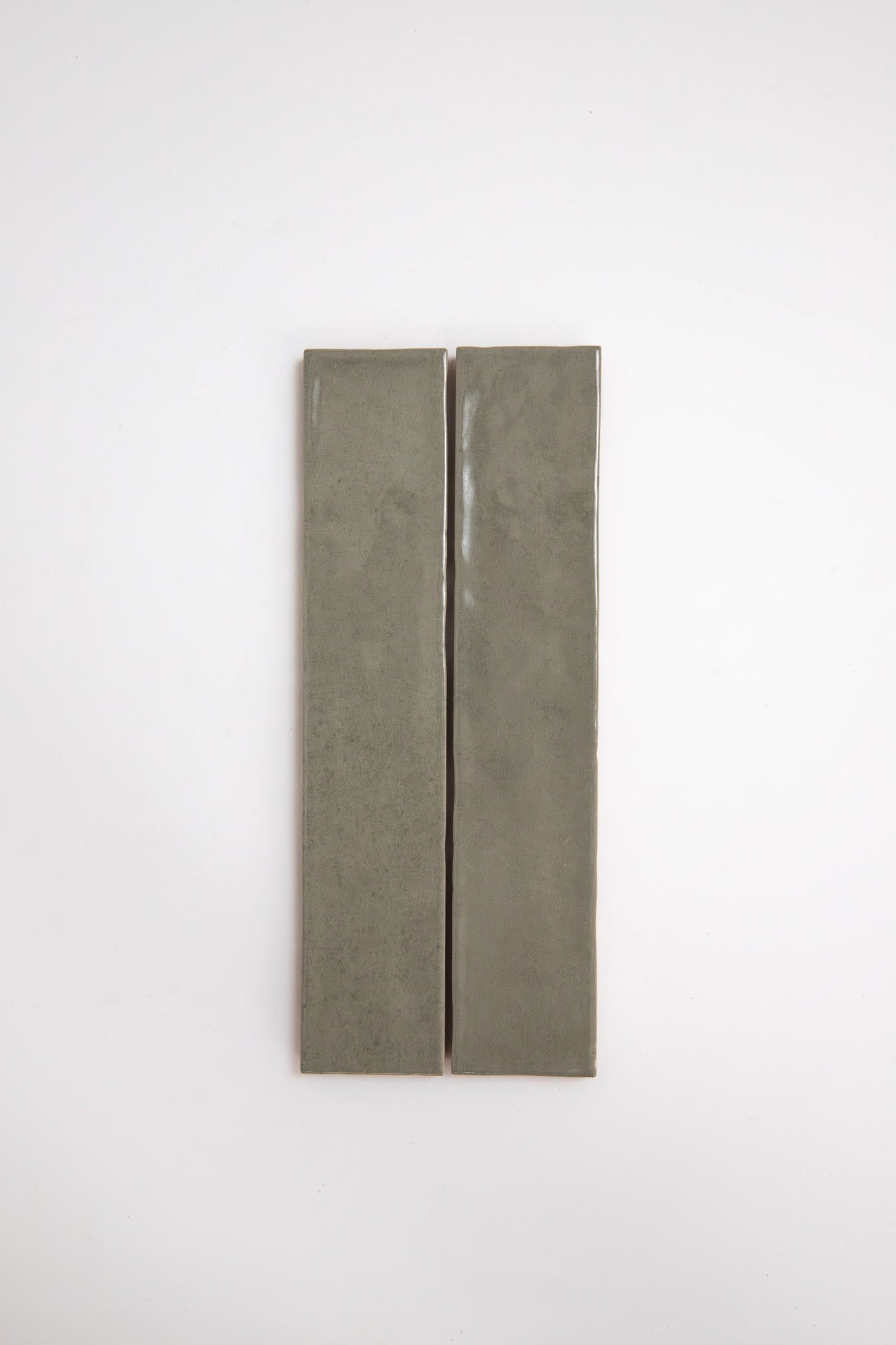 Two long, rectangular Skye Green tiles by Cottage Ivy placed vertically side by side on a plain white background.