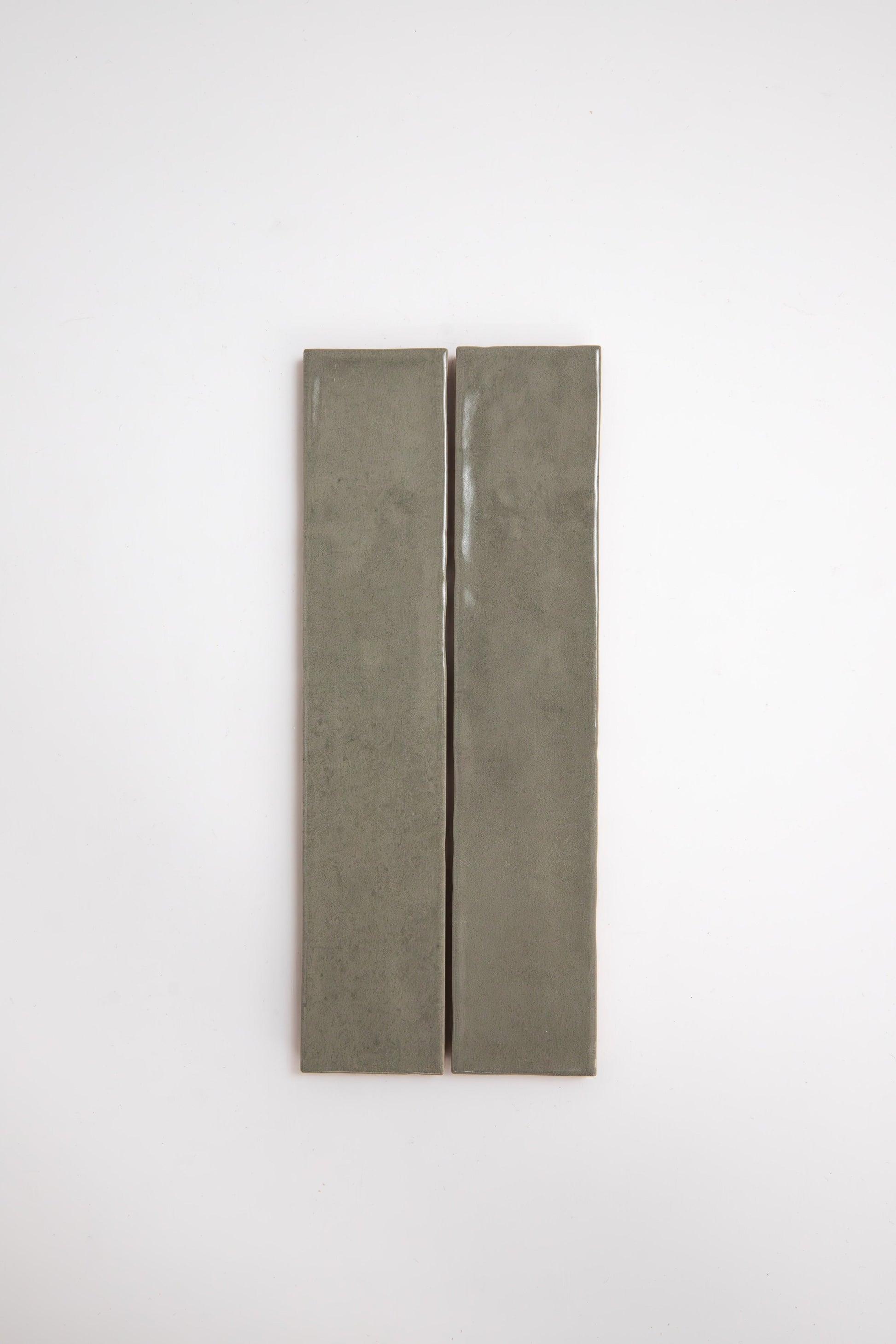 Two long, rectangular Skye Green tiles by Cottage Ivy placed vertically side by side on a plain white background.