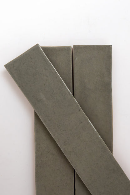 Three Skye Green tiles by Cottage Ivy on a white background—two vertical, one diagonally arranged.