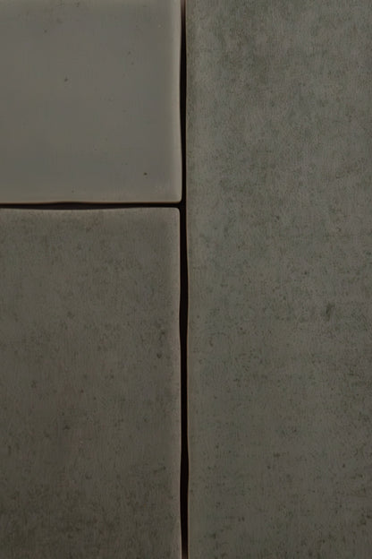 Close-up of four Skye Green tiles by Cottage Ivy, with matte finish, uneven edges, and narrow grout lines.