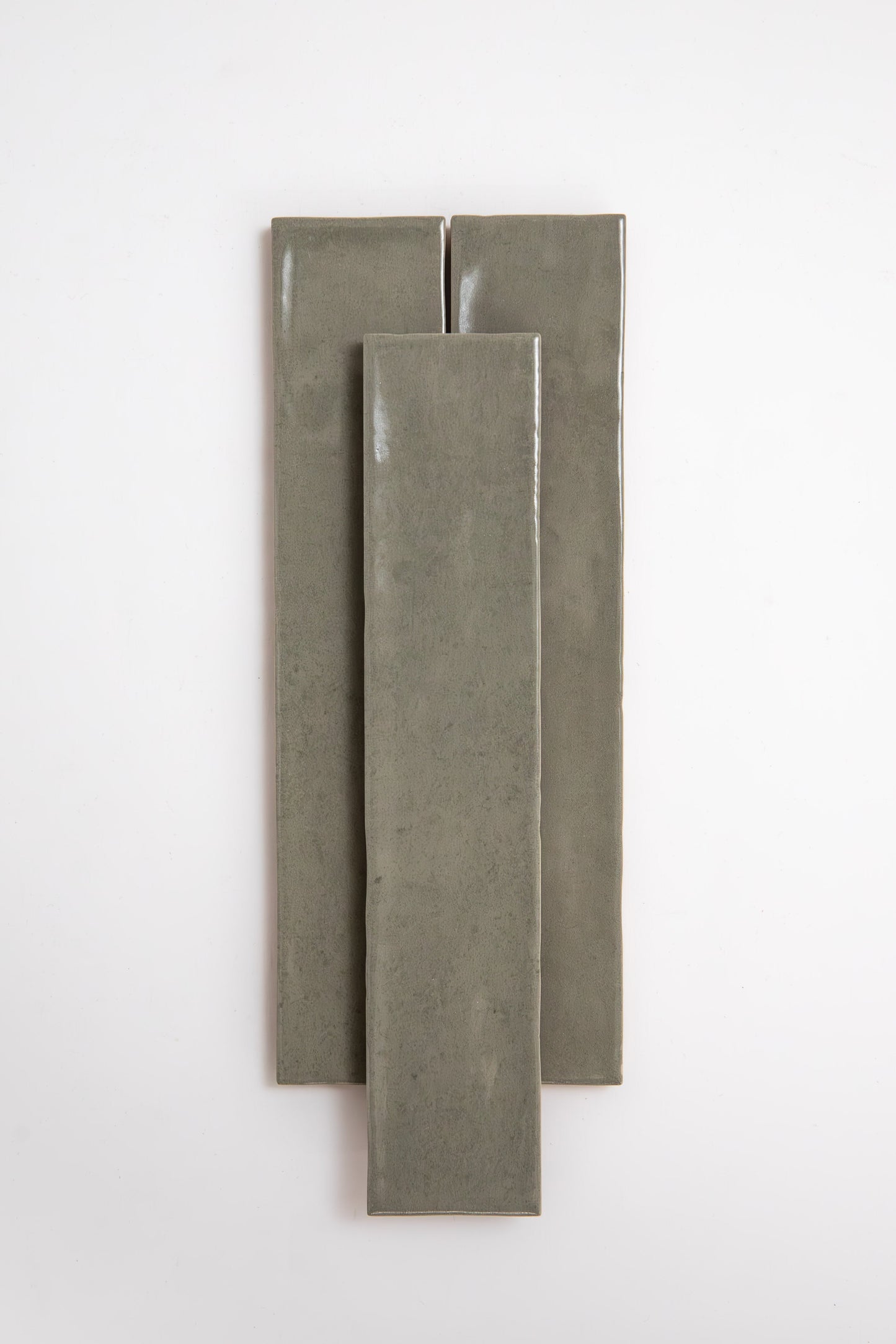 Three long, rectangular Skye Green tiles by Cottage Ivy are arranged vertically on a plain white background.