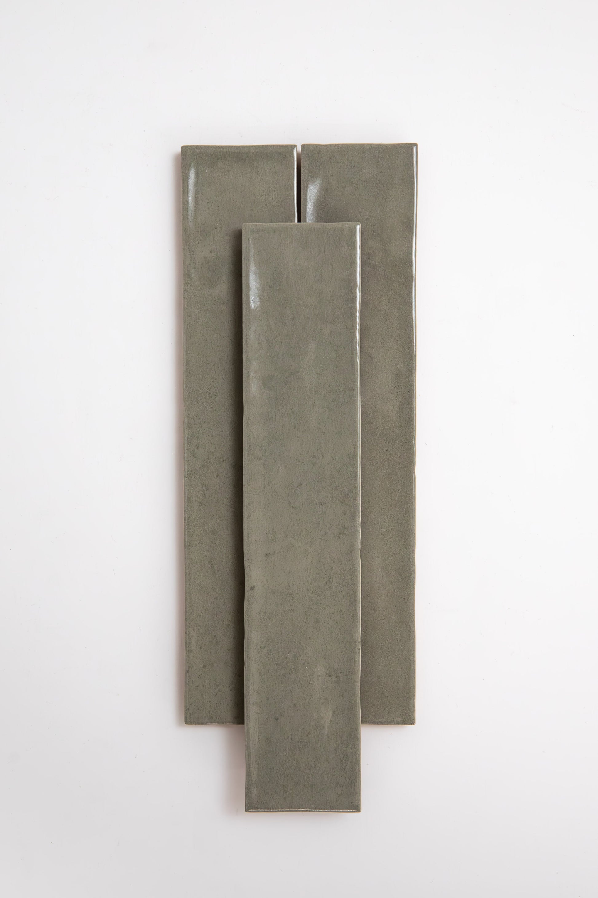 Three long, rectangular Skye Green tiles by Cottage Ivy are arranged vertically on a plain white background.