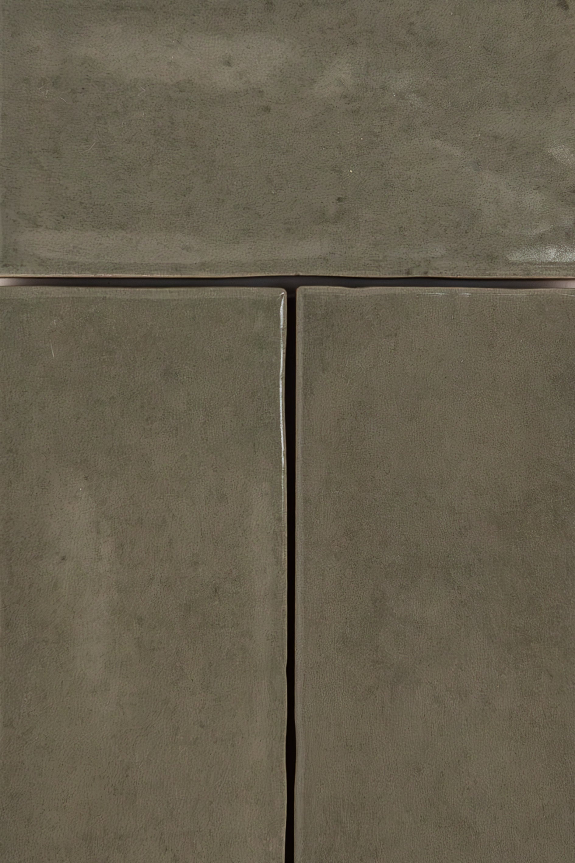 Three Skye Green tiles by Cottage Ivy with grout lines and a slightly textured surface. Extra sample.