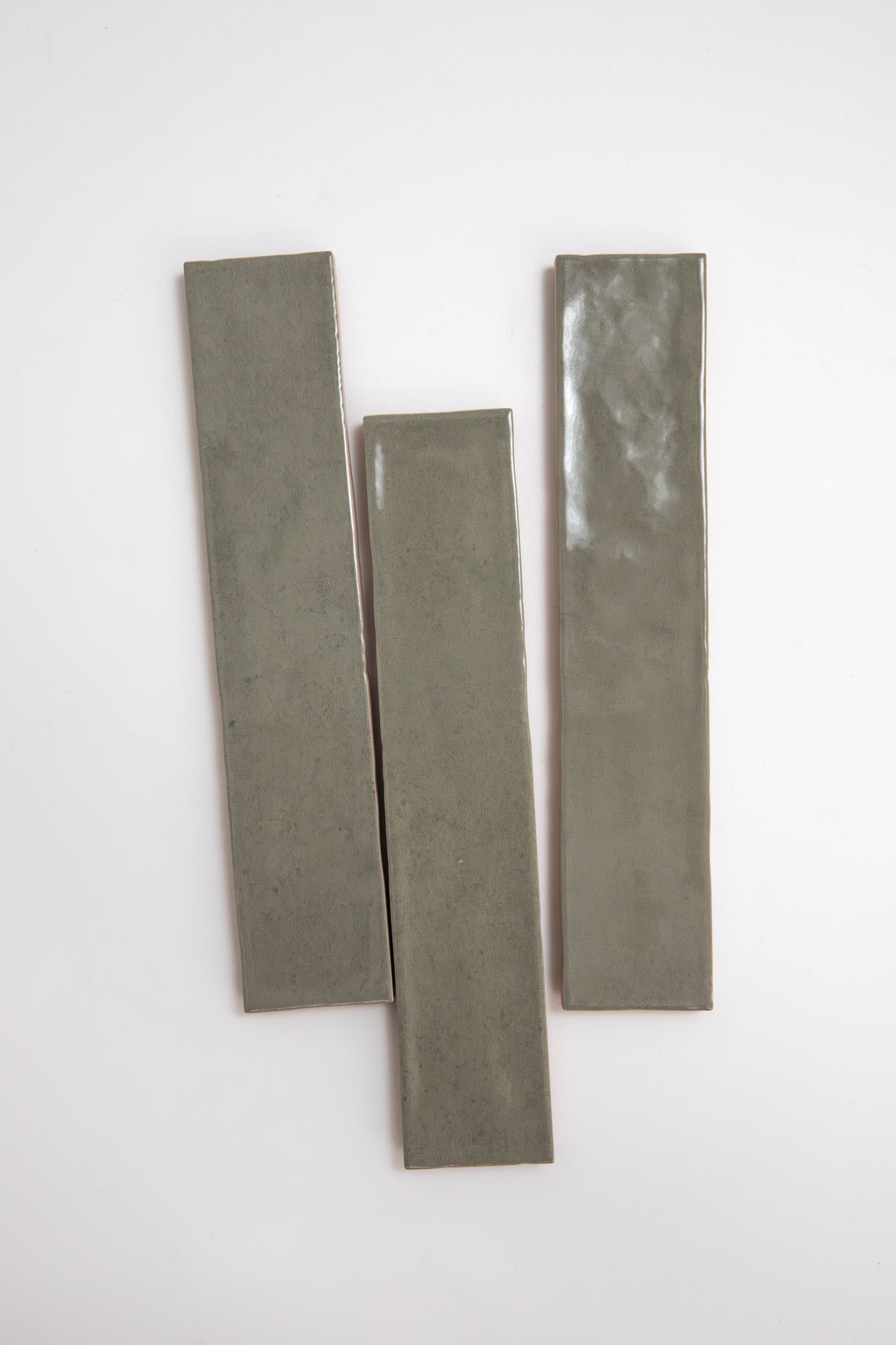 Three rectangular Skye Green ceramic tiles by Cottage Ivy are arranged vertically on a plain white background.