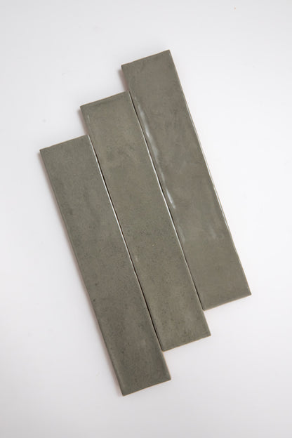 Three Skye Green rectangular tiles by Cottage Ivy are stacked in a staggered arrangement on a white background.