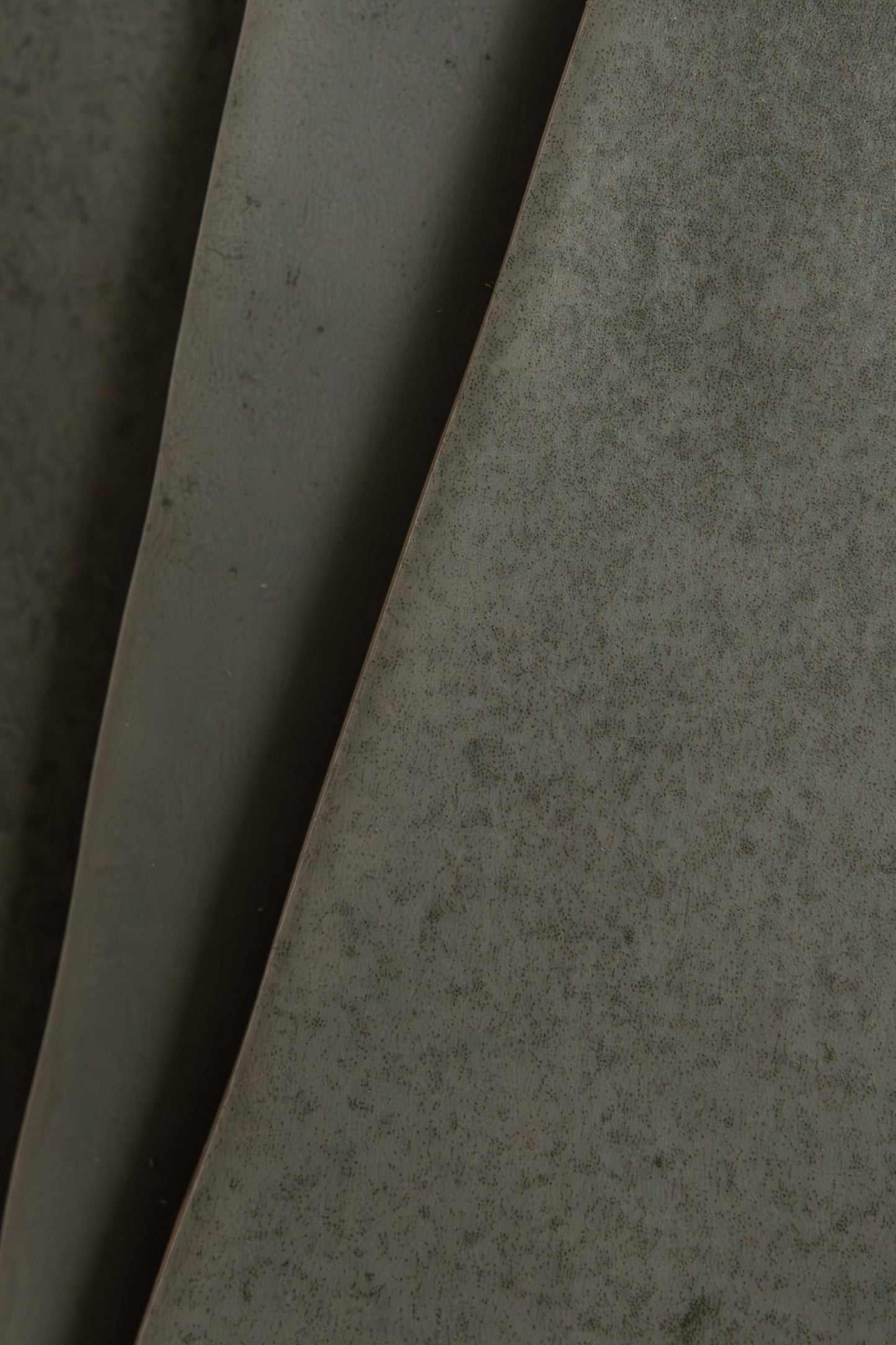 Close-up of Skye Green, Extra Sample by Cottage Ivy: large matte green leaves with subtle speckled patterns.