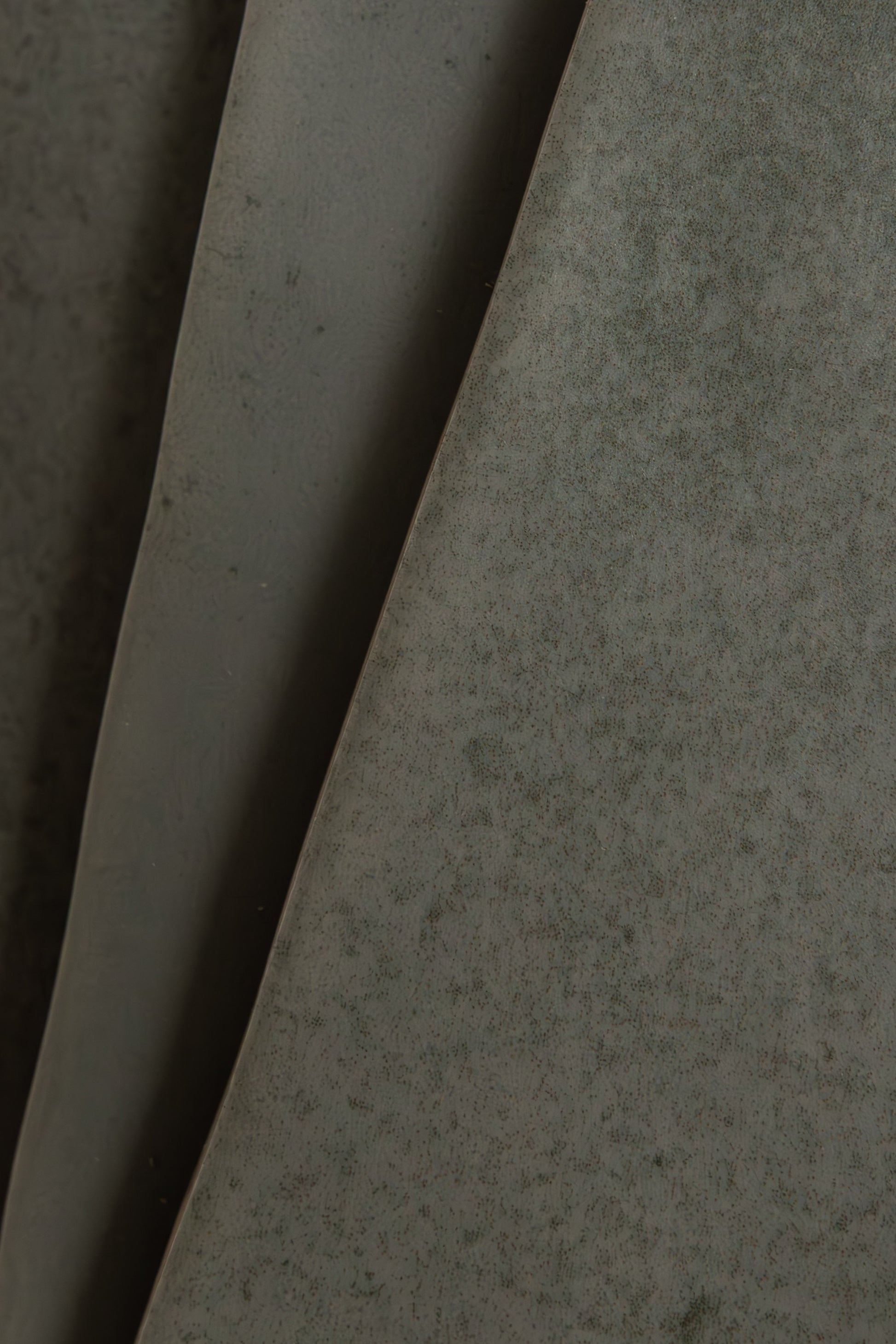 Close-up of Skye Green, Extra Sample by Cottage Ivy: large matte green leaves with subtle speckled patterns.
