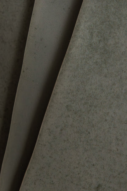 Close-up of Skye Green, Extra Sample by Cottage Ivy: large matte green leaves with subtle speckled patterns.
