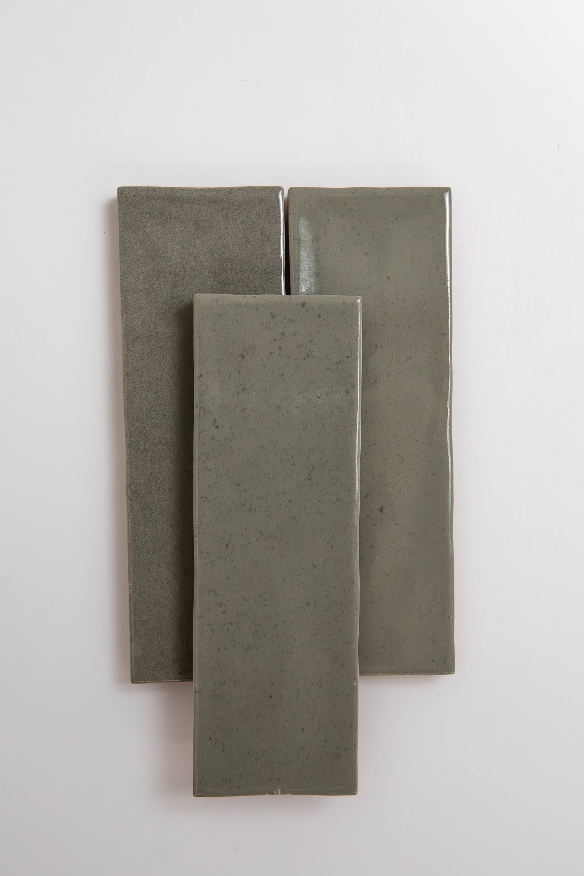Three Skye Green tiles by Cottage Ivy are stacked vertically and overlapping on a plain white background.