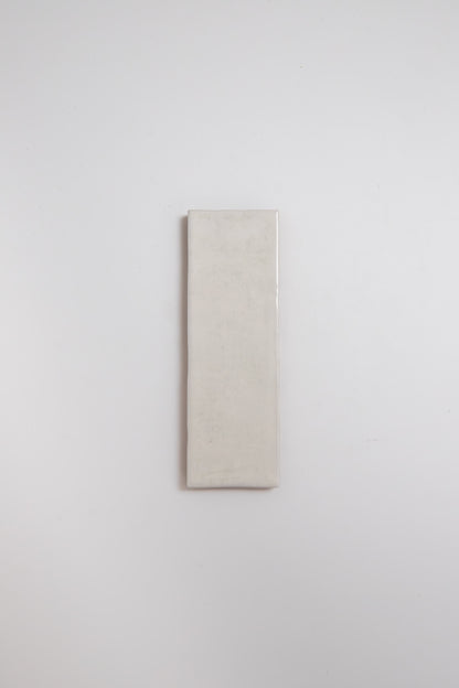 A single Snowshill White tile sample by Cottage Ivy is centered on a plain white background.