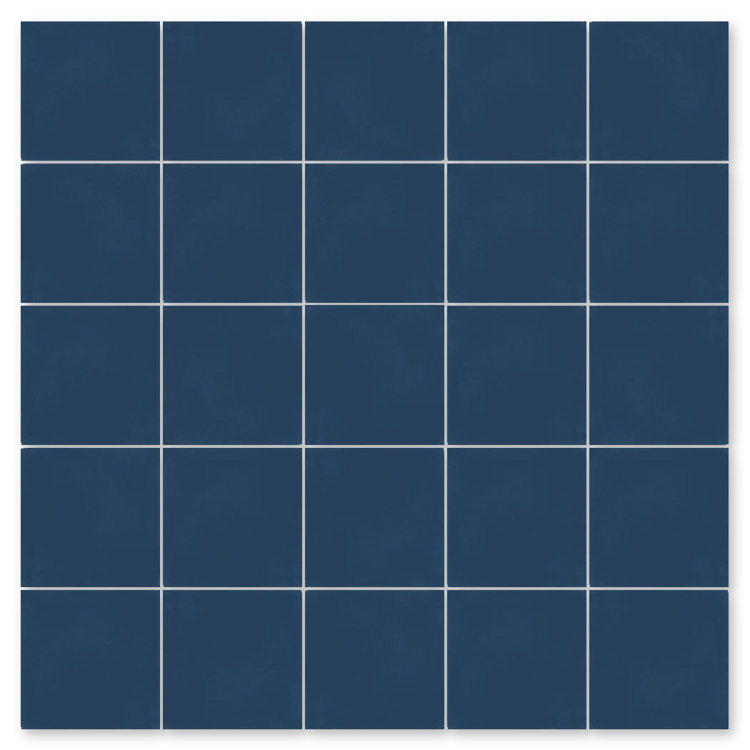 A grid of 25 New York Cement Tile 4412-Solid 4x4 dark blue samples with thin white grout on a white background.