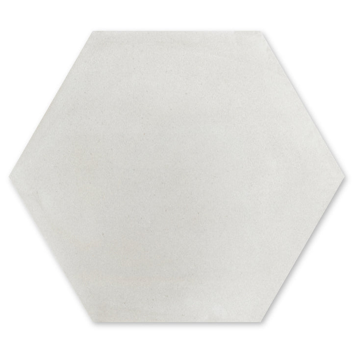 Solid Hex -Mixed Grey by New York Cement Tile: a light gray hexagon tile with a smooth, matte finish.