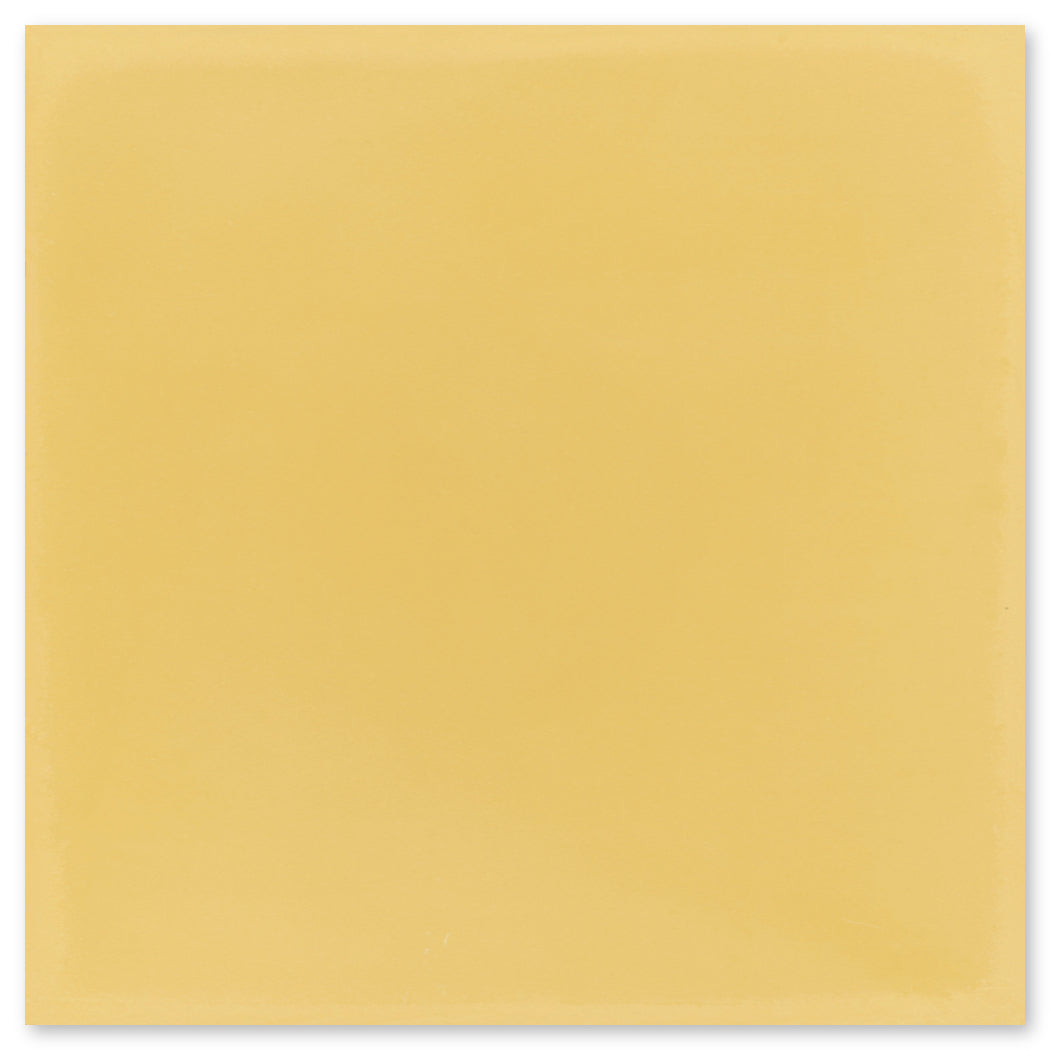 The 7710-Solid 4x4 tile by New York Cement Tile features a smooth, solid light yellow look with subtle edge shading.