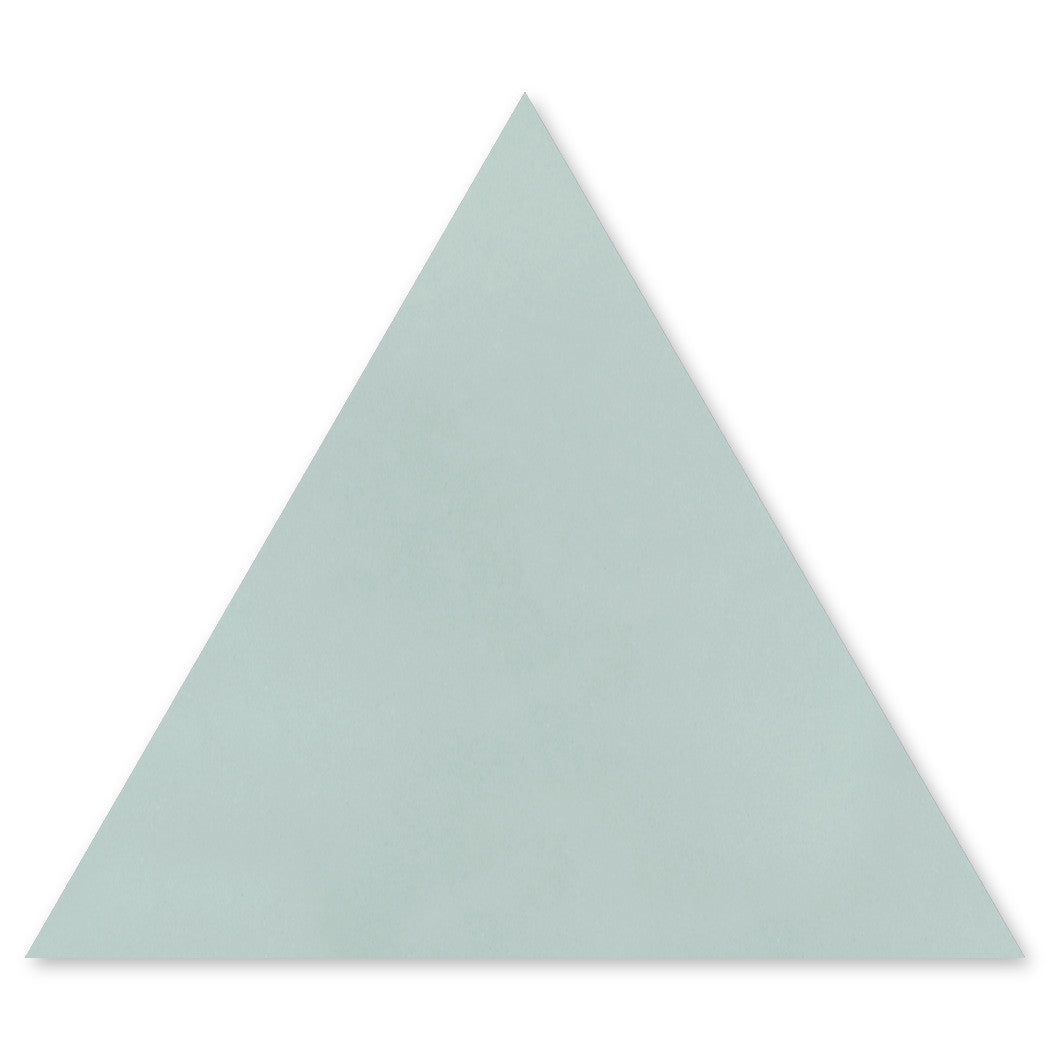 A light gray 4402-Solid Triangle tile sample by New York Cement Tile, inspired by geometric design tiles.