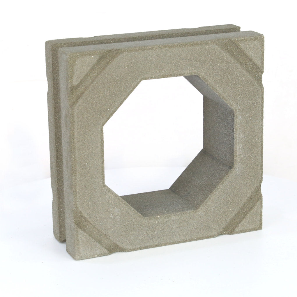 The Sumar Sample by New York Cement Tile is a gray breeze block with an octagonal hole, perfect for modern partitions.