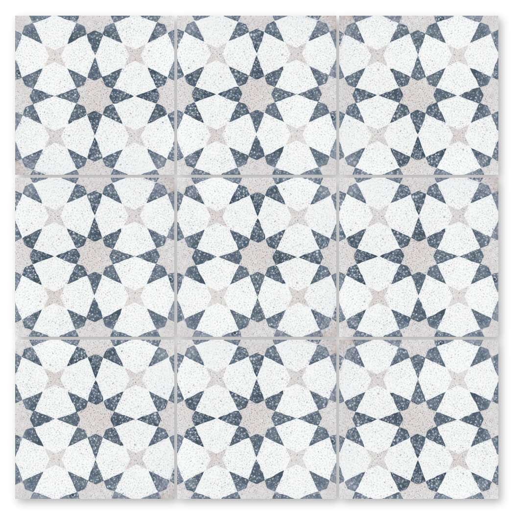 NT20-271 by New York Cement Tile features a bold geometric pattern with white, dark blue, and light gray star shapes.