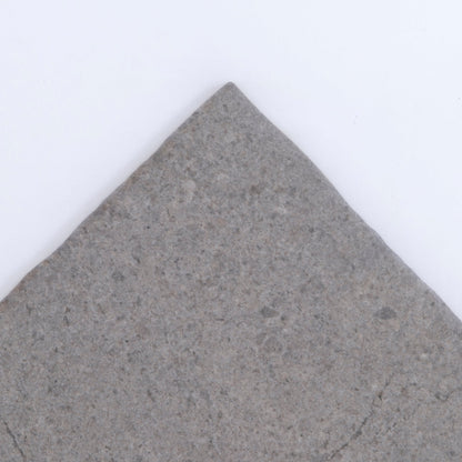 The Toba Basilica R11 Sample tile by Toba features a pointed corner and gray stone finish on a white background.
