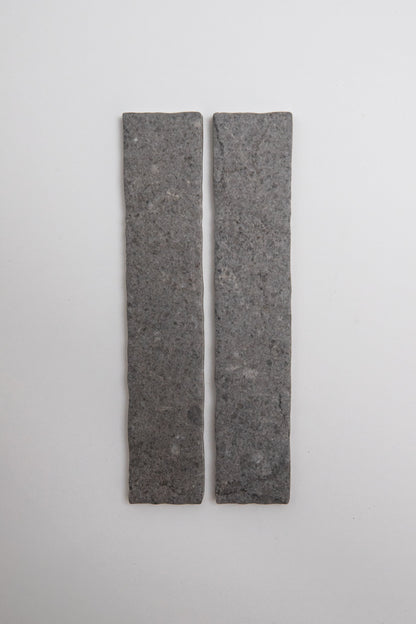 Two rectangular Toba Basilica R11, Sample tiles by Toba stand vertically side by side on a plain, light background.