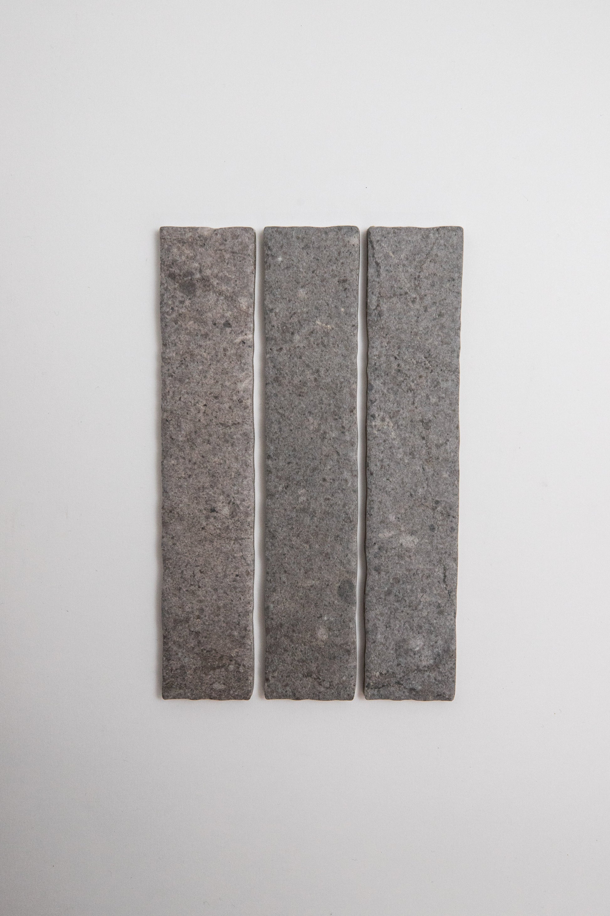 Three Toba Basilica R11 tiles by Toba arranged vertically on a plain white background.