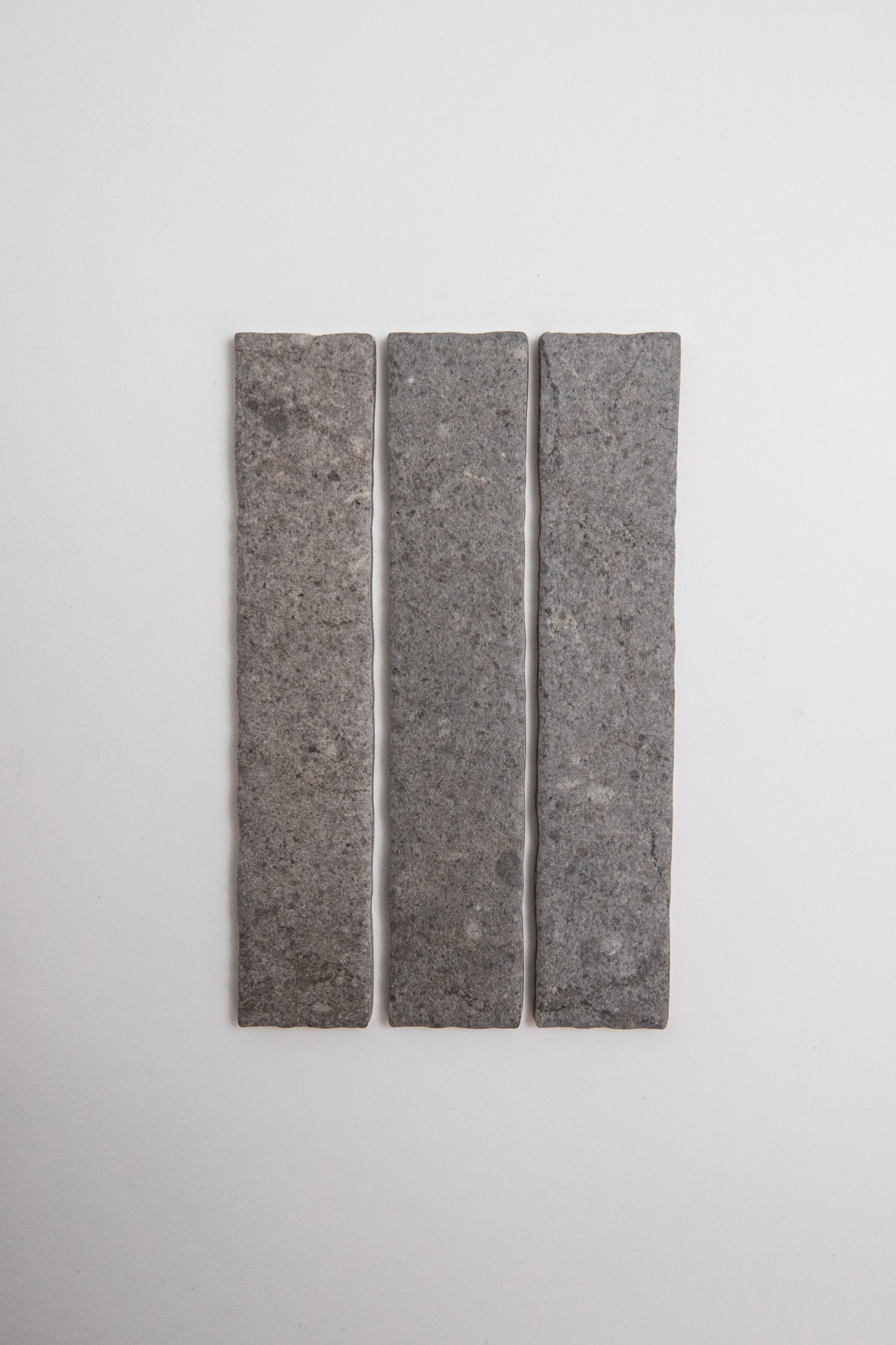 Three Toba Basilica R11 tiles by Toba arranged vertically on a plain white background.