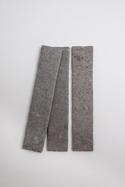 Two Toba Basilica R11, Sample slabs by Toba placed side by side on a plain white background.