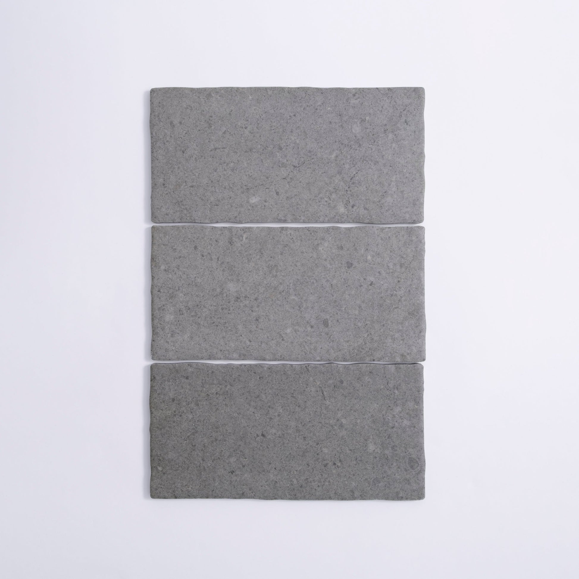 Three Toba Basilica R11 sample tiles by Toba are arranged vertically in a row on a white background.