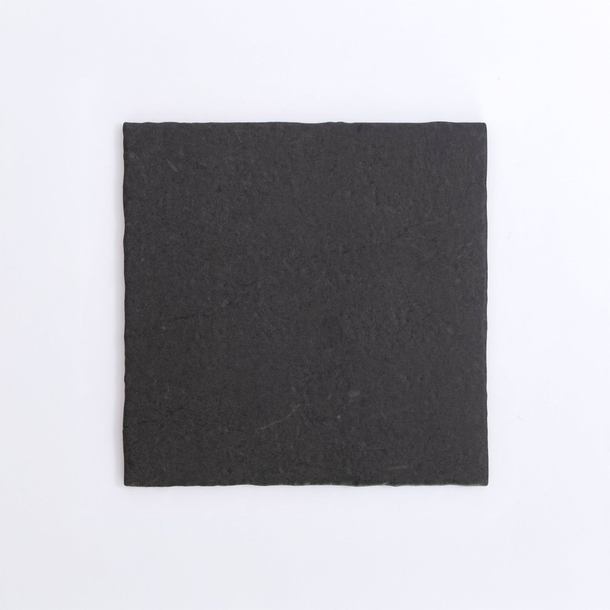 A single vertical Toba Black R11 strip by New York Cement Tile centered on a plain white background.