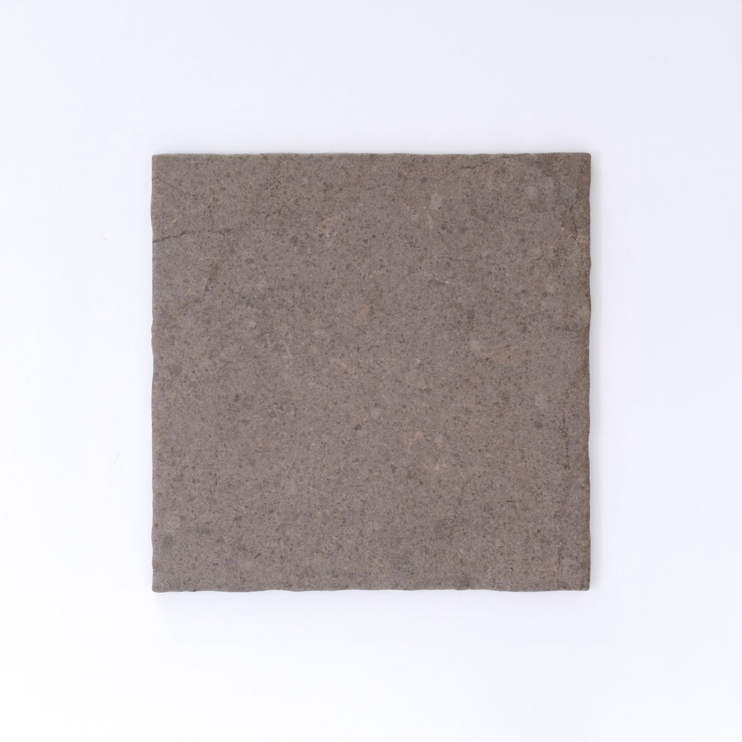 Three Toba Brun R11 crispbreads by New York Cement Tile, rectangular and dark brown, side by side on a white background.