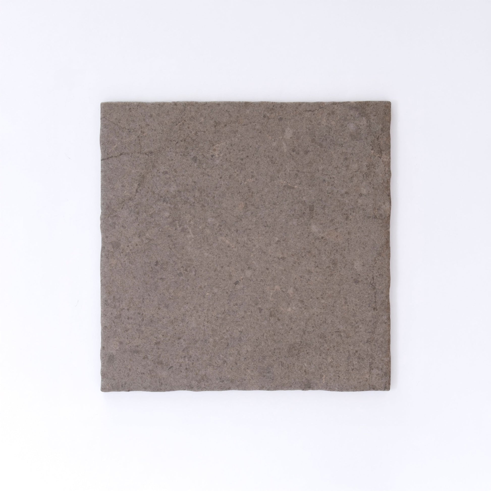 Three Toba Brun R11 crispbreads by New York Cement Tile, rectangular and dark brown, side by side on a white background.