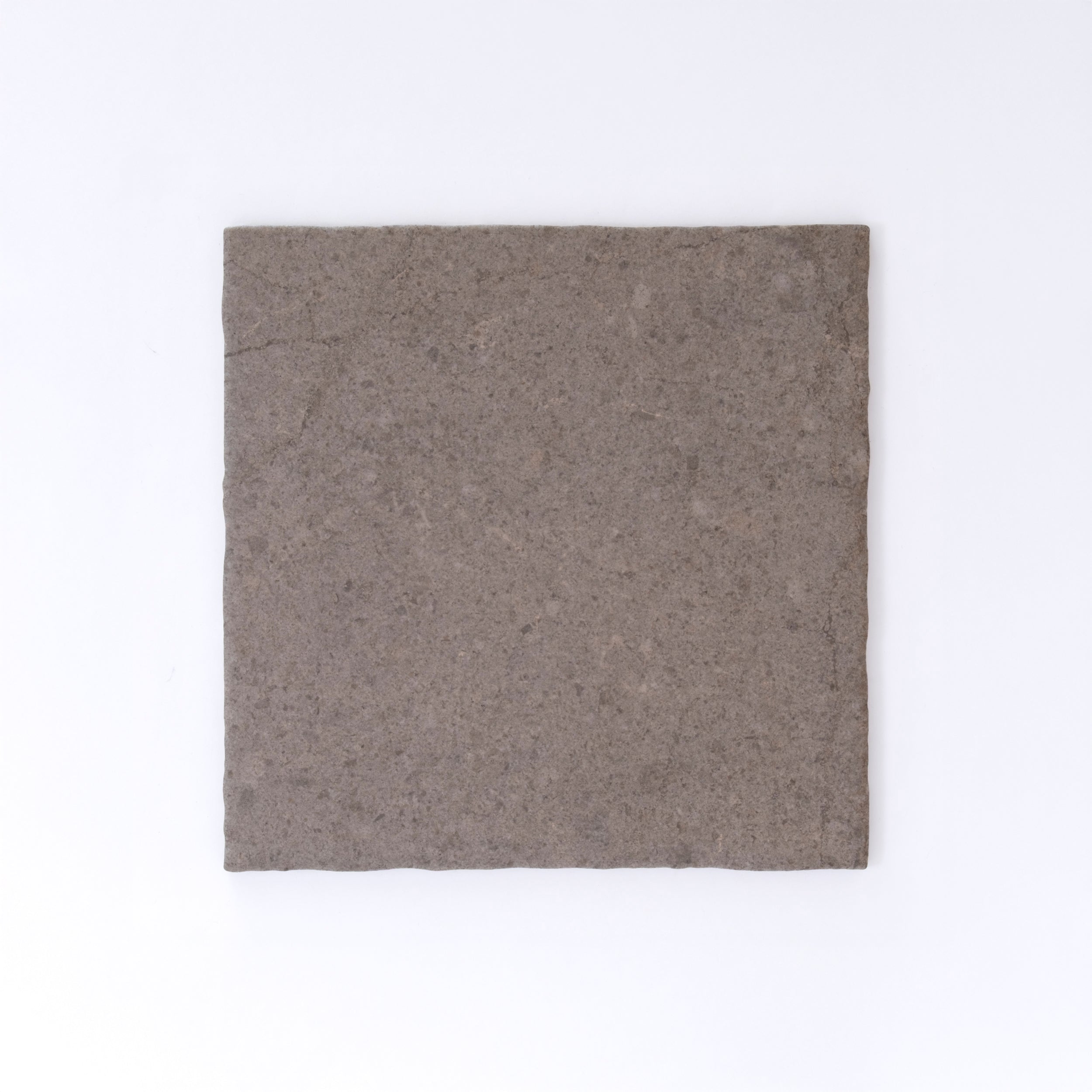 Three Toba Brun R11 crispbreads by New York Cement Tile, rectangular and dark brown, side by side on a white background.