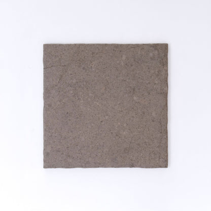 Three Toba Brun R11 crispbreads by New York Cement Tile, rectangular and dark brown, side by side on a white background.