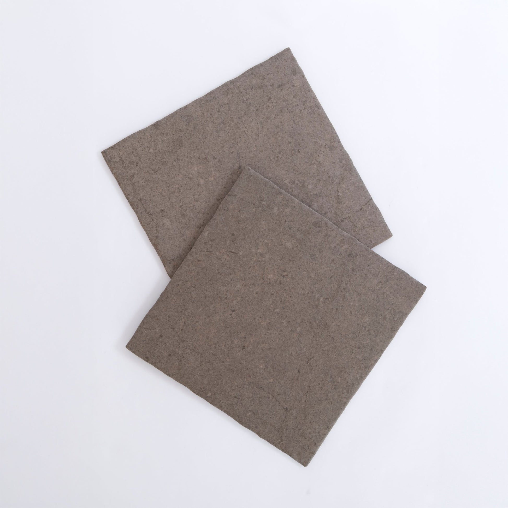 Two square Toba Brun R11 samples overlap on a plain white background.