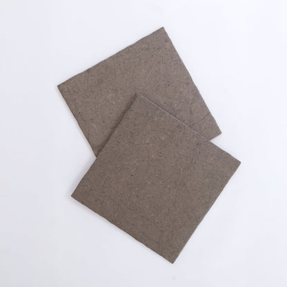 Two square Toba Brun R11 samples overlap on a plain white background.