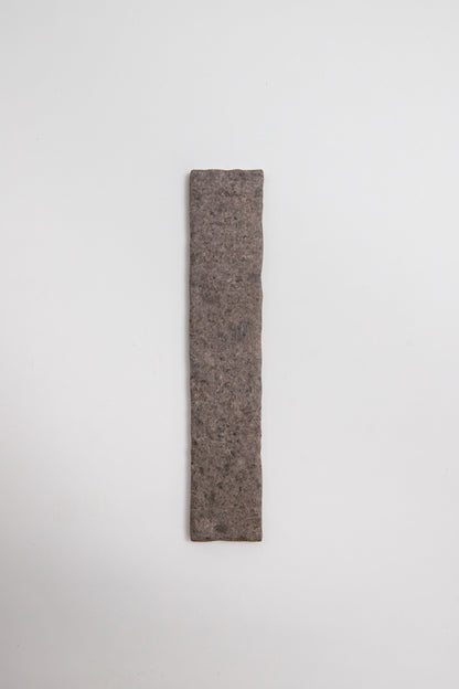 A single Toba Brun R11 tile sample is centered on a plain white background.