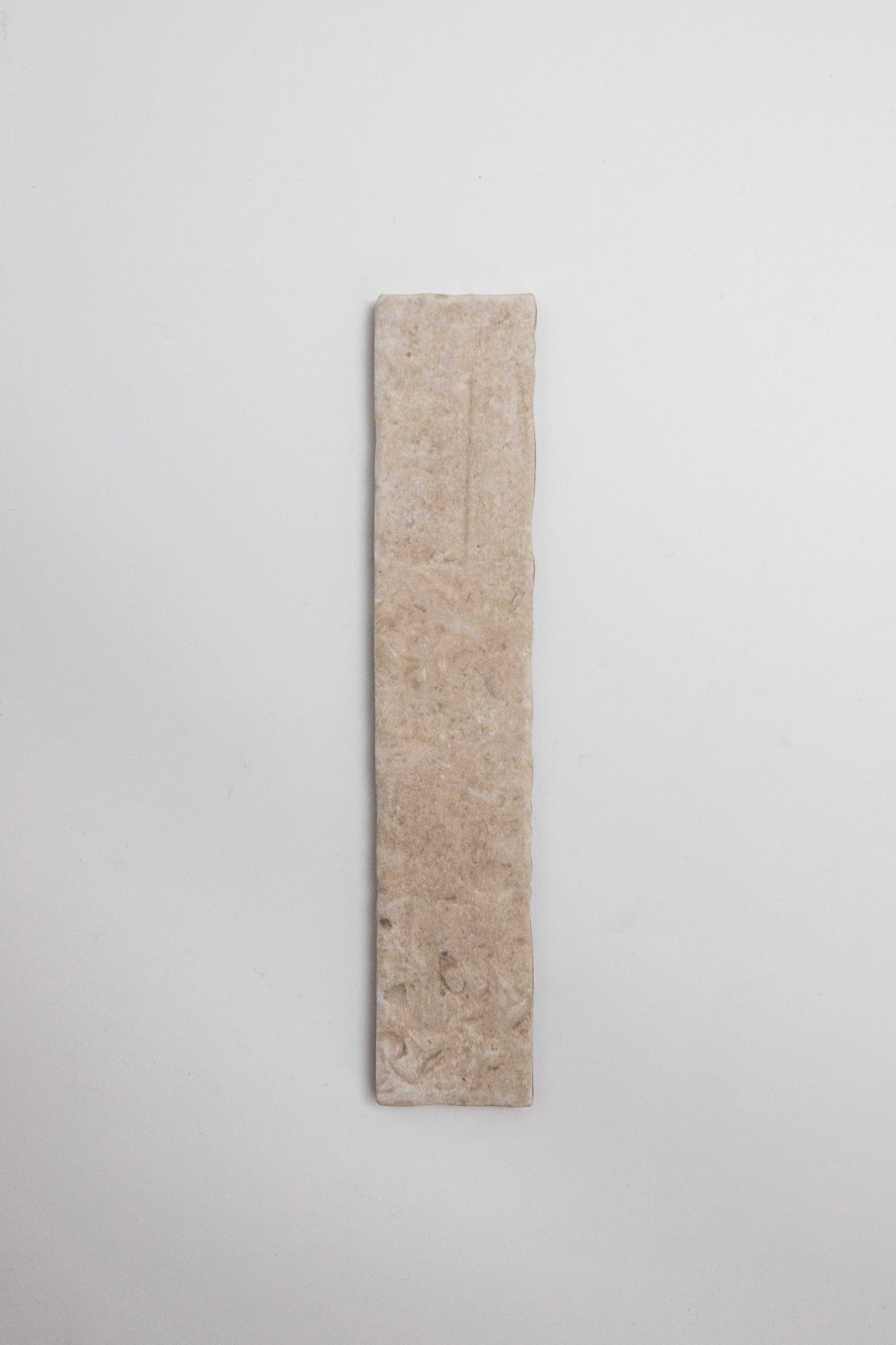 A single Toba Ivory R11 flatbread is centered on a plain white background.