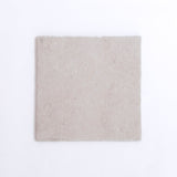 A single Toba Multicolor R11 tile by New York Cement Tile, featuring a subtle textured surface on white background.