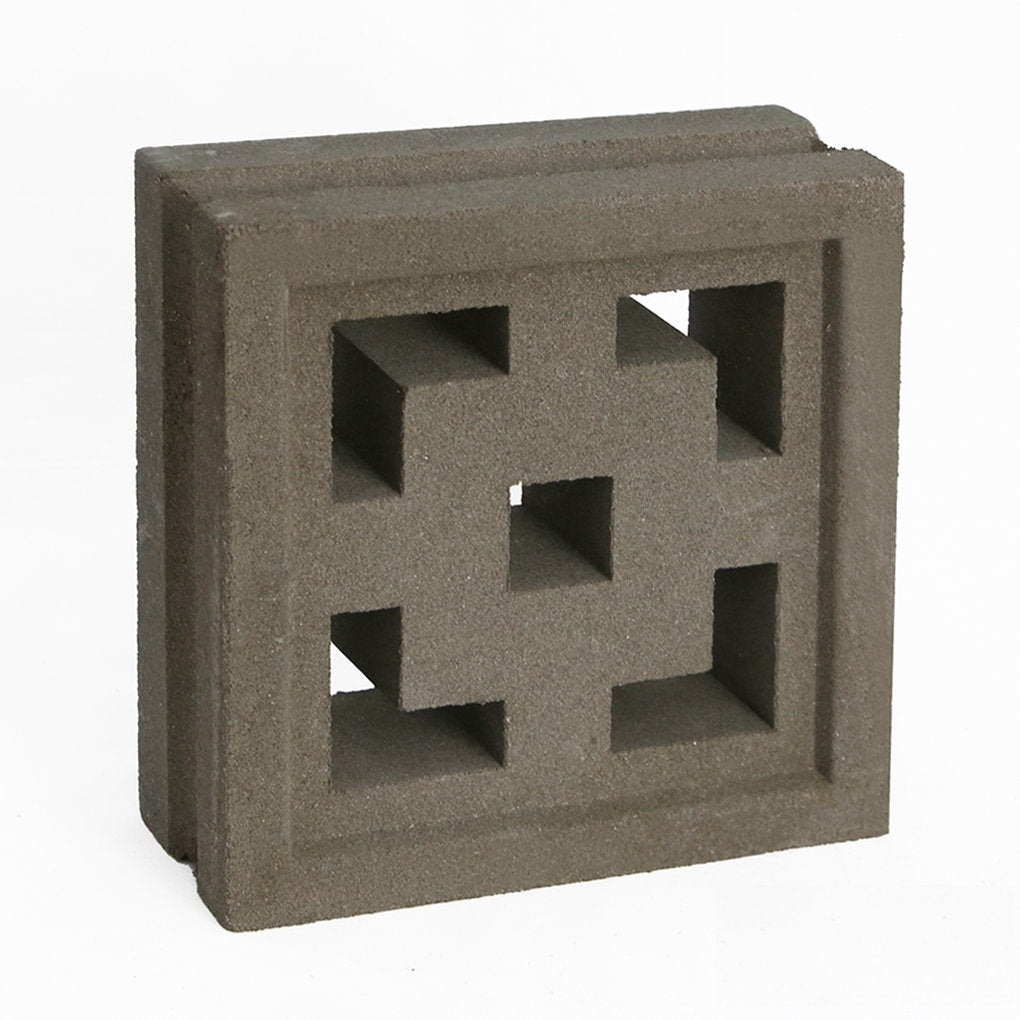 The Tong by New York Cement Tile is a gray breeze block with geometric cutouts, ideal for mid-century modern spaces.