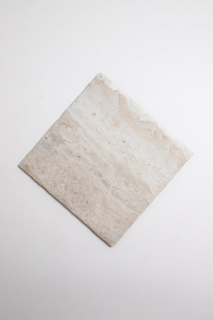 A single Tosca Travertine rectangular beige tile placed diagonally on a plain white background.