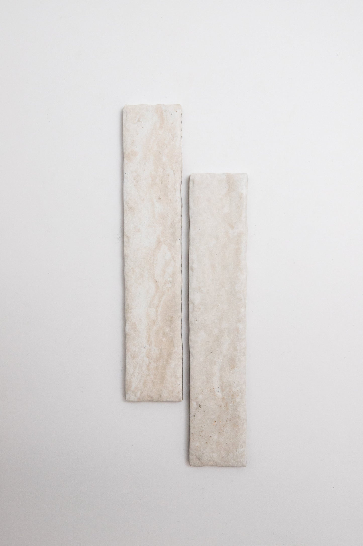 Two rectangular Tosca Travertine tiles shown vertically side by side on a plain white background.